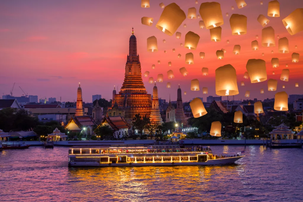 Wat arun and cruise ship in night time and floating lamp in yee peng festival under loy krathong day, Bangkok city ,Thailand