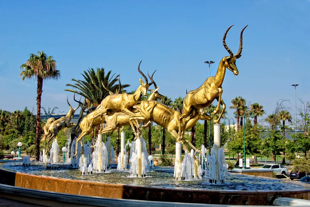 Jumping gold springboks in Gold Reef City. South Africa