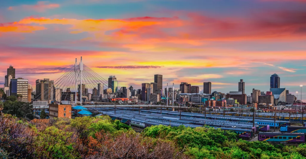 Nelson Mandela Bridge and Johannesburg city at sunset